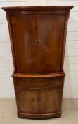 A Georgian style Serpentine fronted drink cabinet, pull out drawer and a two drawer cupboard to base