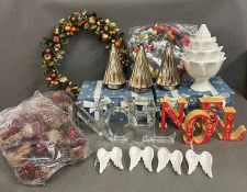 A collection of Christmas decorations including reef, carved Noel wooden letter