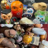 A large selection of Owl's various sizes, makers and materials