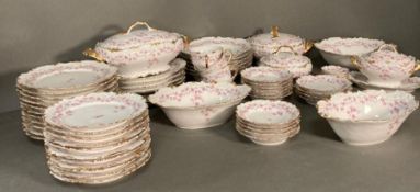 A French Limoges "Rose" dinner service to include serving dishes, bowls, and plates