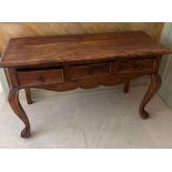 A console table with three drawers to centre on cabriole legs (H78cm W130cm D54cm)