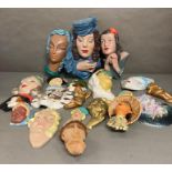 A large selection of wall hanging masks and plaques