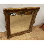 A gilt framed carved mirror 85cm x 80cm