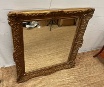 A gilt framed carved mirror 85cm x 80cm