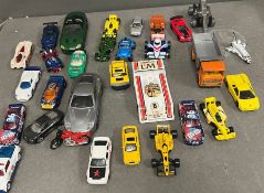 A selection of play worn diecast toys to include cars, rockets etc