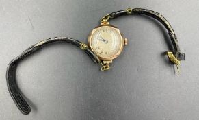 A Ladies 9ct gold watch on a leather strap