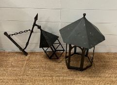 A cooper hanging lantern and a iron wall hanging lantern