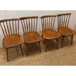 Four Danish stick back chairs