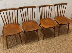 Four Danish stick back chairs