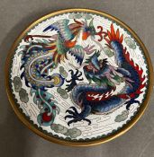 A Chinese cloisonne dish decorated with dragons on reverse decorated with two dragons playing with a
