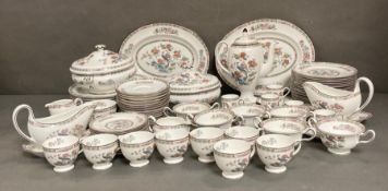 A part Wedgewood Kutani Crane dinner service to include platters, cups, saucers and serving dishes