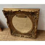 A gilt Gesso style square frame with oval mirror plate 80cm x 70cm