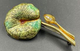A yellow metal stamped 750, 18ct gold, lotus leaf brooch. Formed from a stylised lotus leaf,
