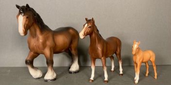Three china horses including a Beswick foal.