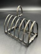 A silver toast rack, approximate weight 140g, hallmarked for Sheffield by Atkin Brothers,
