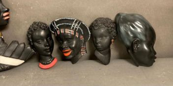 A selection of traditional African wall hanging plaques