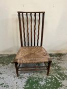 An Arts and Crafts occasional chair with rush seat