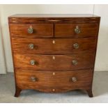 A mahogany bow fronted inlaid chest, two short drawers over three graduated long drawers