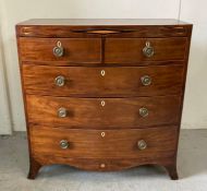 A mahogany bow fronted inlaid chest, two short drawers over three graduated long drawers