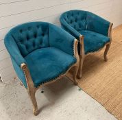 A pair of turquoise tub chairs (Fabric AF)