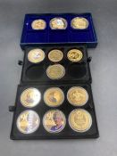 A selection of various gold plated presentation coins