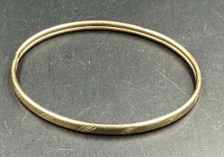 A 9ct gold bangle, approximate total weight 5.4g