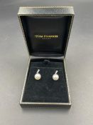 A pair of pearl and diamond drop earrings on 750 white gold setting.