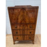 A walnut cabinet with cupboard and drawers below (H120cm W68cm D45cm)