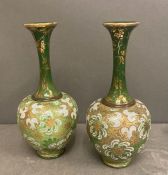 Two hand painted Royal Doulton vases in chartreuse green with gilt and white painted flowers .