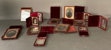 A selection of fourteen late nineteenth century leather cased photographic portraits