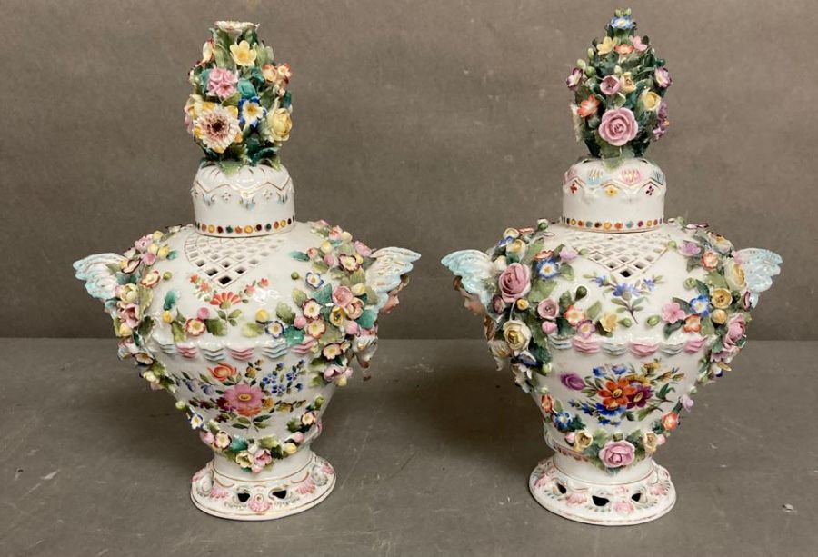 A pair of Sitzendorf porcelain lidded vases with floral decoration H25cm