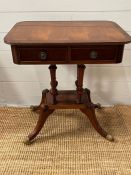 A regency style mahogany side table on four turned central pillars terminating on a square base