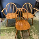 Three Ercol stick back dining chairs