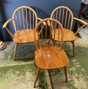 Three Ercol stick back dining chairs