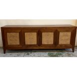 A contemporary four panel sideboard with bur walnut style veneer doors opening to adjustable