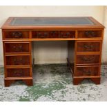 A reproduction pedestal desk with blue leather top (H78cm W122cm D60cm)