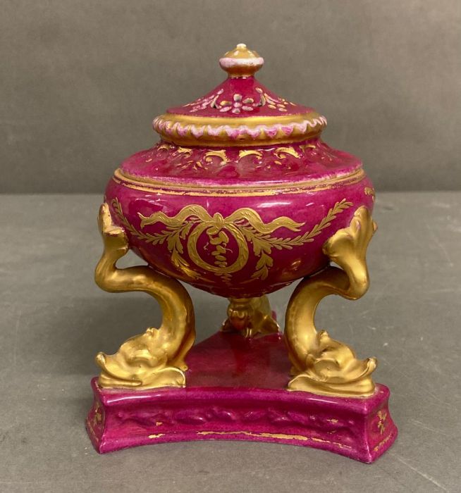 A 19th century miniature urn by Sevres. Red grounds with gold detail