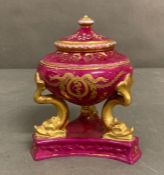 A 19th century miniature urn by Sevres. Red grounds with gold detail