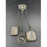 An antique white metal chatelaine with two hallmarked silver vesta cases and a continental (800