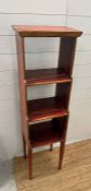 A faux painted and gilt three tier waterfall bookcase