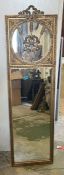 A tall gilt mirror with wheat and ribbon carved to top panel 153cm x 43cm