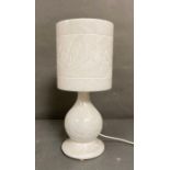 A vintage carved marble table lamp