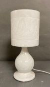 A vintage carved marble table lamp