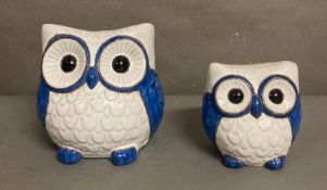 Two decorative ceramic owls in blue and white