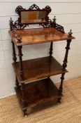 A Three tier rosewood whatnot with mirrored gallery to top, turned supports, castors (H125cm W60cm