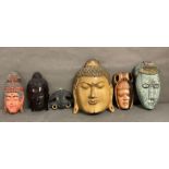 A selection of South East Asian wall hanging masks