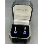 A pair of pear shaped sapphire and diamond drop earrings by local acclaimed jeweller Anthony Paul