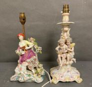 Two German figural porcelain table lamps in the manner of Dresden, two children and a reclining lady
