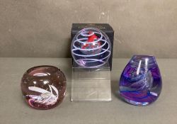 A selection of three Caithness paperweights, one boxed.