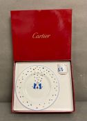 A boxed Cartier "La Maison Des Enfants" plate and egg cup with blue panthers